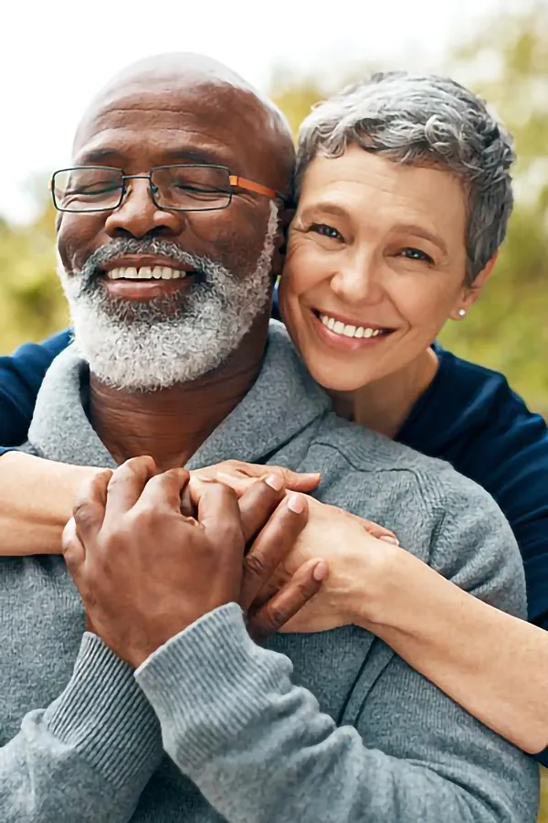 CJC-1295-Peptide-Treatment A mature couple embraces outside. Get CJC 1295 anti-aging peptides from Better Life Carolinas of Mount Pleasant in Charleston Metro.