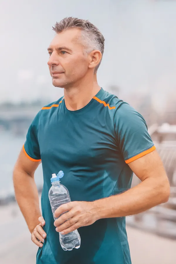 Cardiovascular-Health-Treatment A middle-aged man hydrates after a hard workout. Get cardiovascular health care from Better Life Carolinas of Mount Pleasant in Charleston Metro.