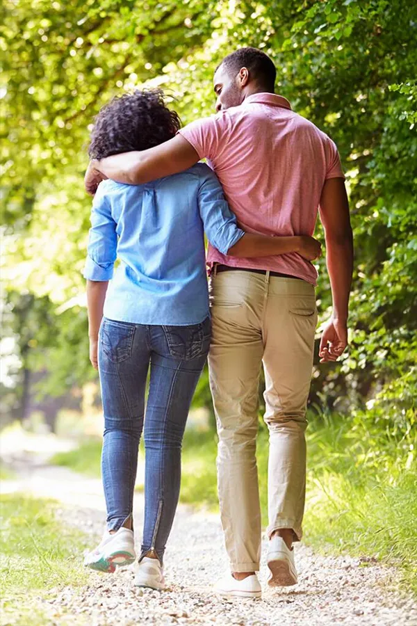Epithalon-Peptide-Treatment A Black couple walk arm and arm on a trail. Get Epithalon Peptide therapy from Better Life Carolinas of Mount Pleasant in Charleston Metro.