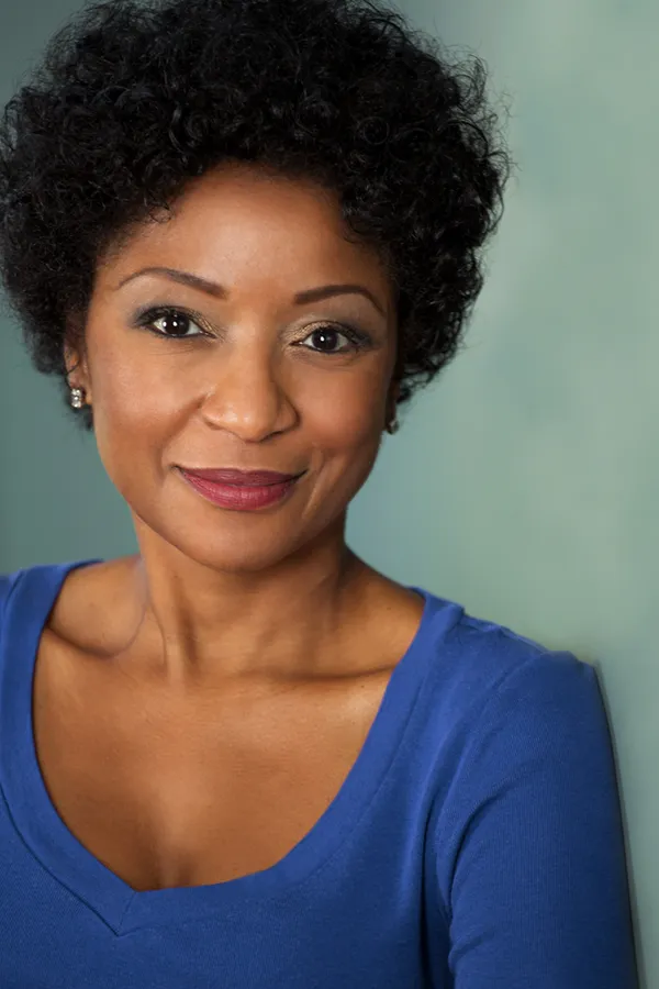 Femiwave-Treatment A middle-aged black woman in a blue shirt smiling. Get FemiWave treatment from Better Life Carolinas of Mount Pleasant in Charleston Metro.