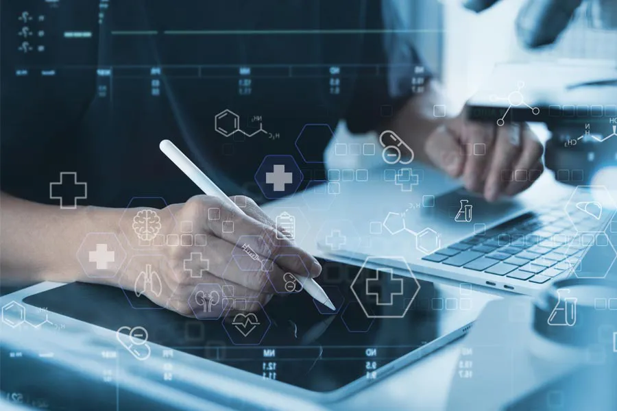 Health-Conditions-Treated-Doctor Close-up of a medical professional using a laptop and tablet, with illustrated medical symbols overlayed on the image, symbolizing health conditions treated by Better Life Carolinas of Mount Pleasant in Charleston Metro.