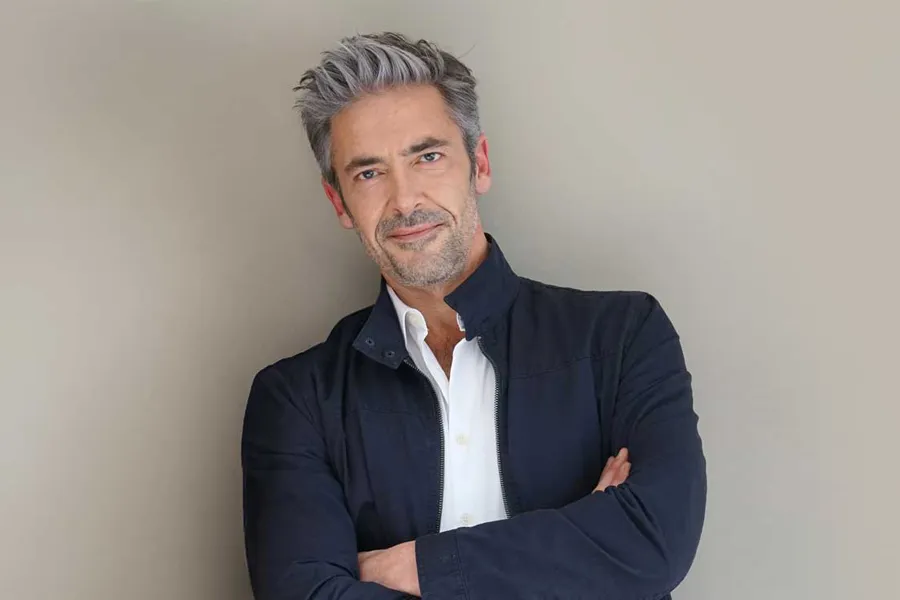 Mens-Health-Clinic A healthy middle-aged man standing against a wall. Schedule a men's health consultation from Better Life Carolinas of Mount Pleasant in Charleston Metro.